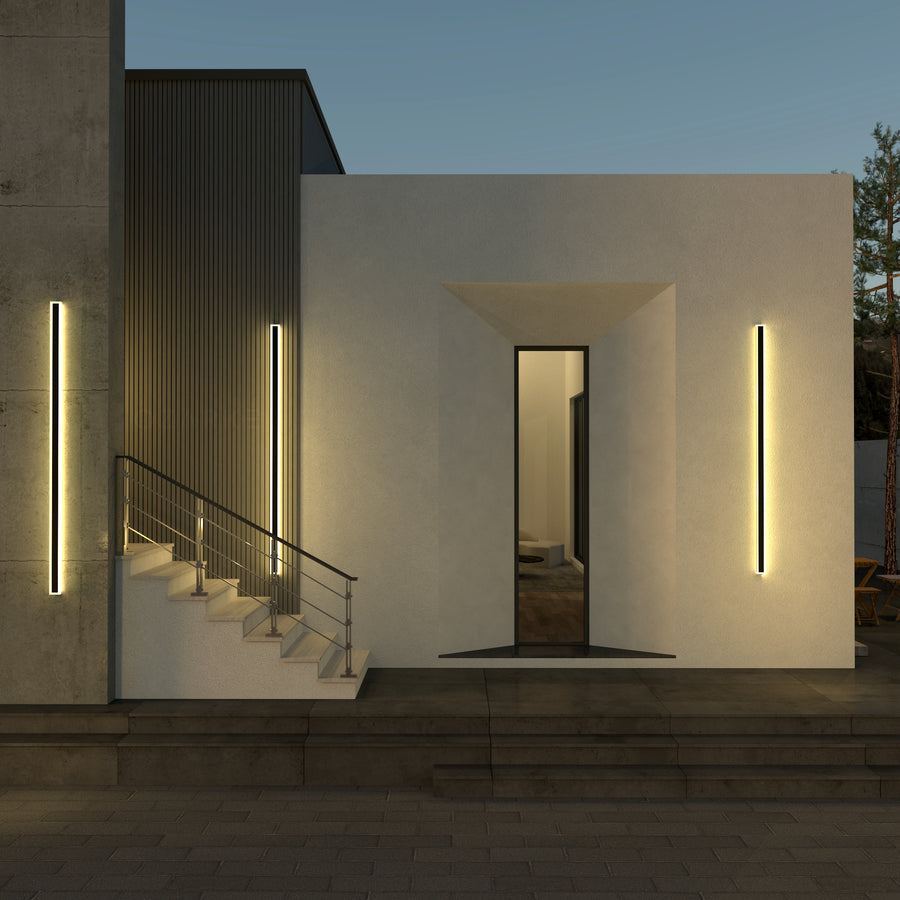 Three immense outdoor linear wall lamps in a modern setting 